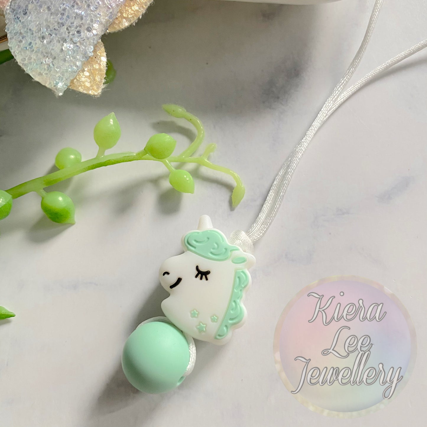 Pastel Green and White sleeping unicorn head kids necklace